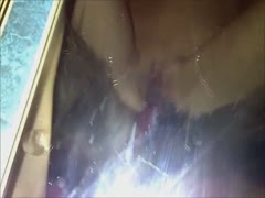 A thin beastie gal is being fucked by a black dog.